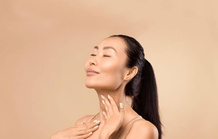 blissful-woman-touching-neck-S